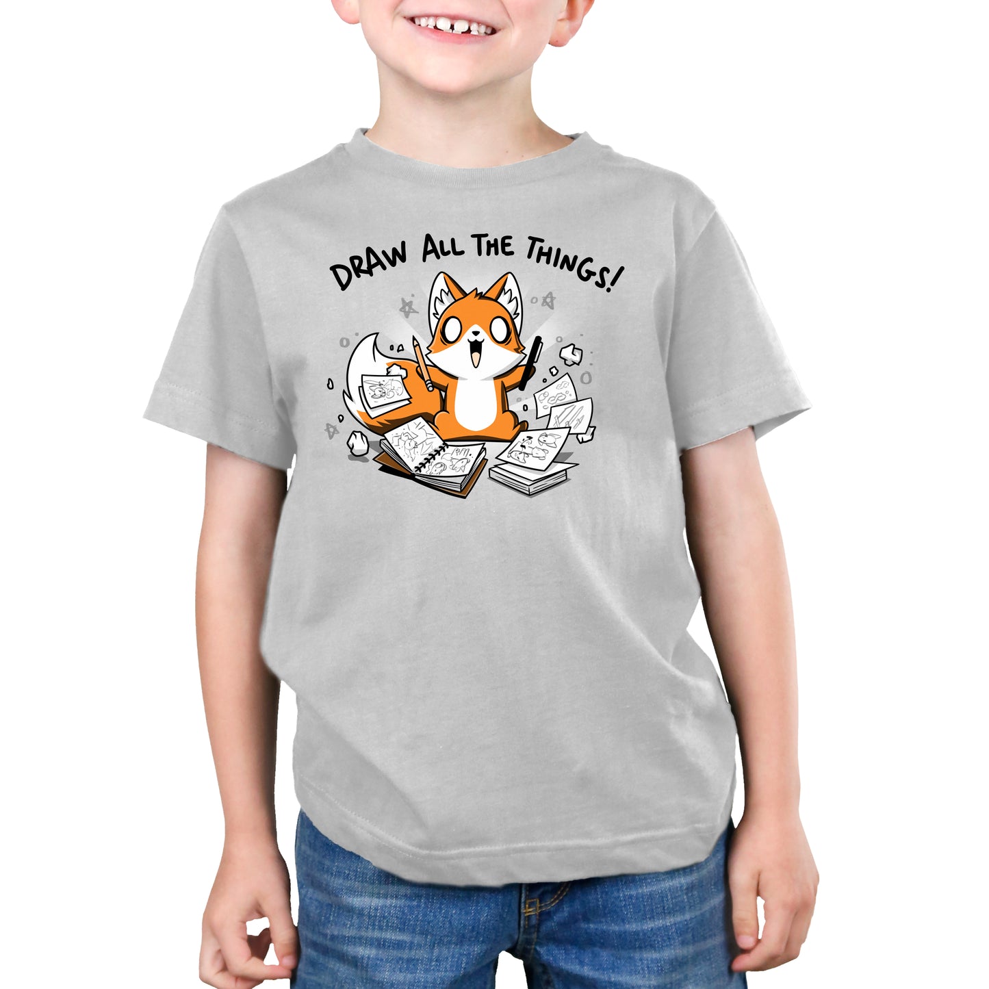 A young boy wearing a TeeTurtle T-shirt that says "Draw All the Things!