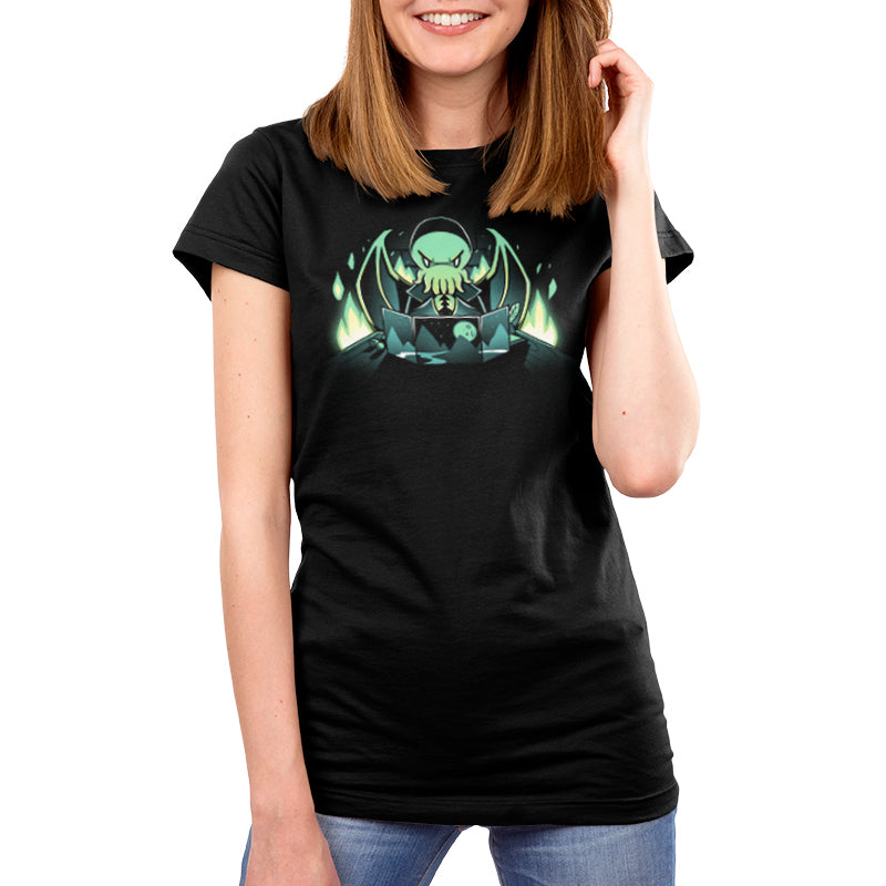 A woman wearing a black t-shirt with a green alien from TeeTurtle's Dungeon Monster design on it in a tabletop adventure.