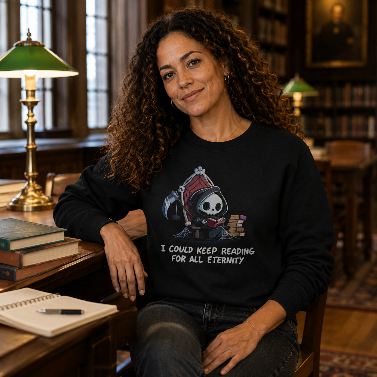 Crew Neck Sweatshirt_TeeTurtle black Eternal Reader featuring the Grim Reaper on a cobwebbed throne reading a book with text, “I could keep reading for all eternity“.