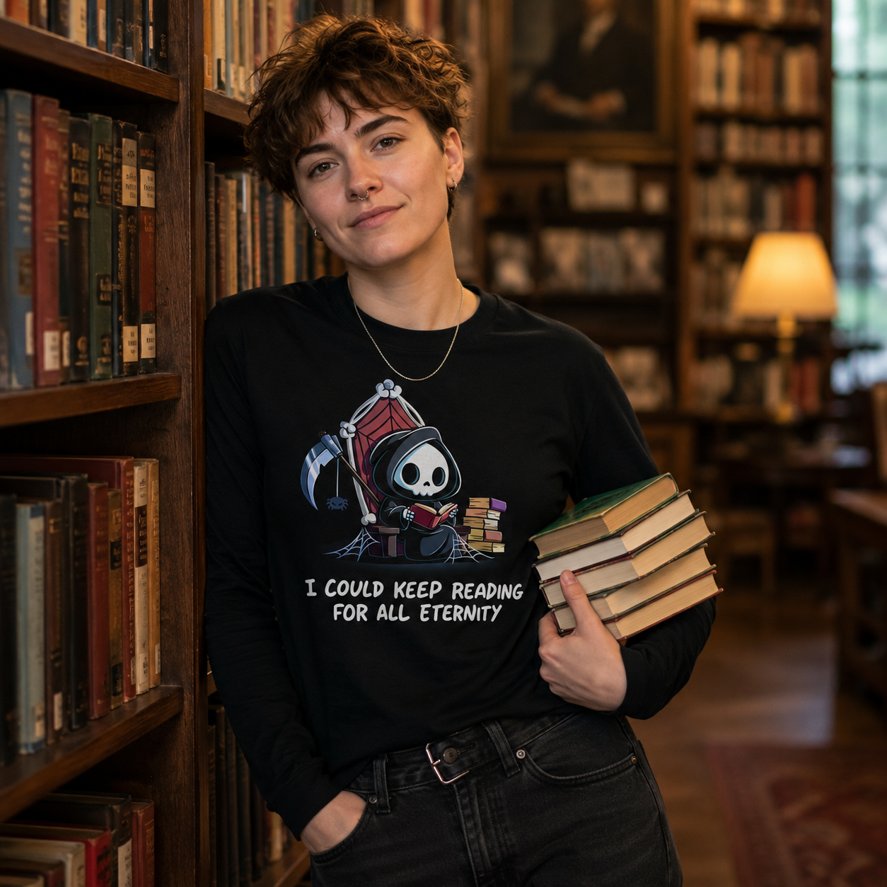 Long Sleeve T-shirt_TeeTurtle black Eternal Reader featuring the Grim Reaper on a cobwebbed throne reading a book with text, “I could keep reading for all eternity“.