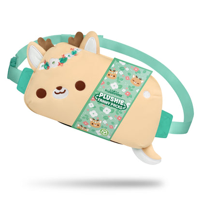 Stuffed animal-themed fanny pack shaped like a cartoon reindeer with a beige body, floral headpiece, teal straps, and smiling face. The package tag reads "TeeTurtle Plushiverse Flora & Fawn-a Plushie Fanny Pack," offering adorable hands-free functionality.