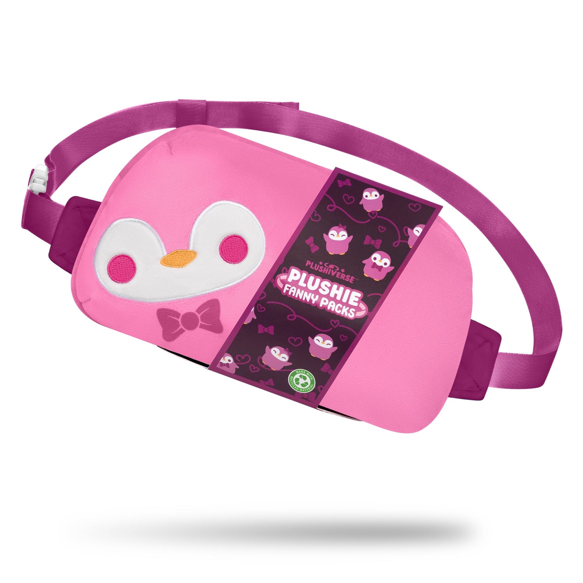 A pink and purple fanny pack with a plush penguin face design, featuring an adjustable belt for a perfect fit and hands-free functionality. The labeled tag reads "Plushiverse Dapper Penguin Plushie Fanny Pack" by TeeTurtle.