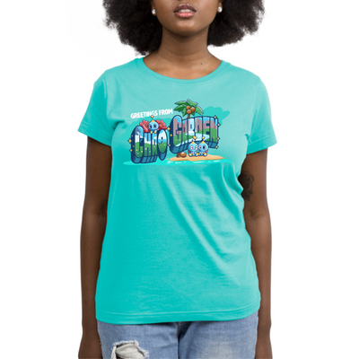 Premium Cotton T-shirt_TeeTurtle caribbean blue Greetings from Chao Garden Premium Cotton T-shirt featuring a vintage postcard design with cute little chao guys on an island with a coconut tree. There is text that reads "Greetings from" at the top and below there is a landscape visible in the bubble letters that spell "Chao Garden"