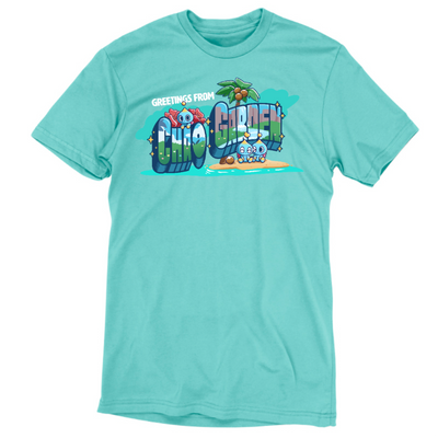 Premium Cotton T-shirt_TeeTurtle caribbean blue Greetings from Chao Garden Premium Cotton T-shirt featuring a vintage postcard design with cute little chao guys on an island with a coconut tree. There is text that reads "Greetings from" at the top and below there is a landscape visible in the bubble letters that spell "Chao Garden"
