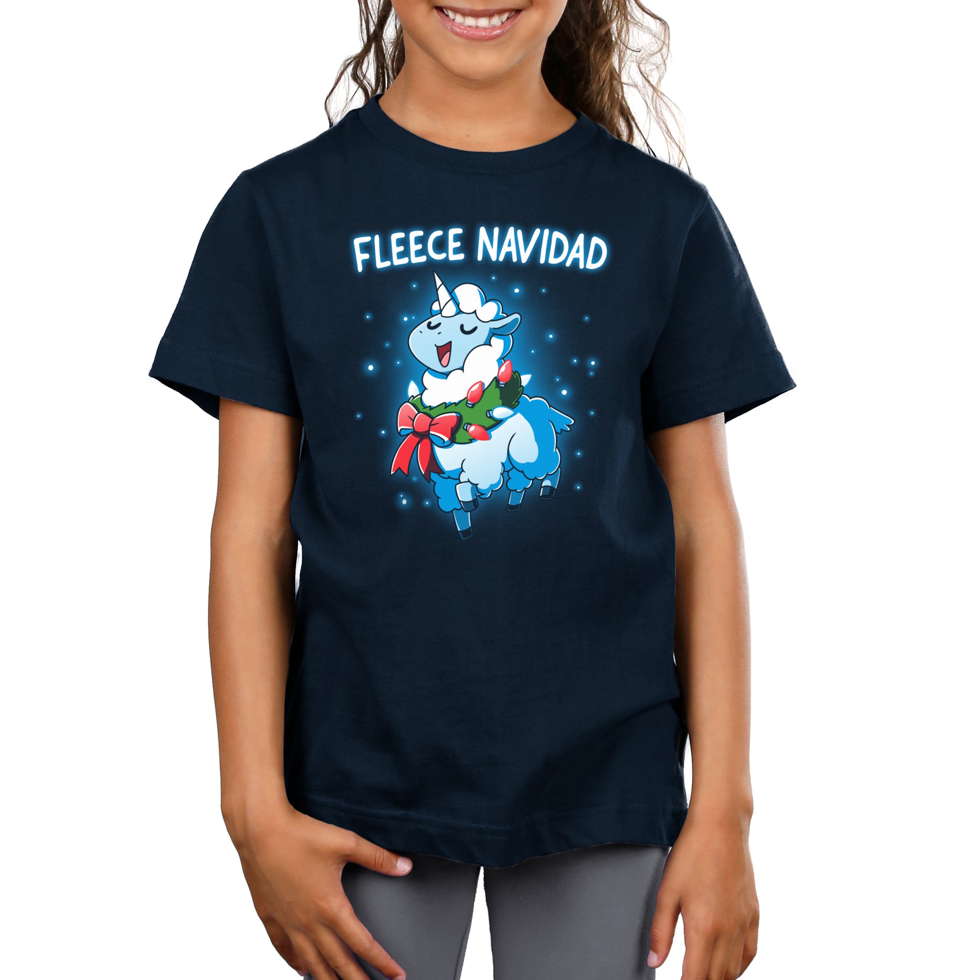 A girl wearing a t-shirt that says Fleece Navidad by TeeTurtle.