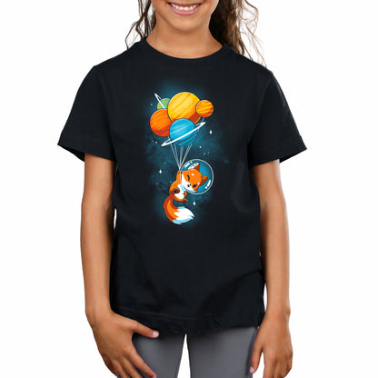 A girl wearing a black t-shirt with a Foxy Astronaut by TeeTurtle on it.