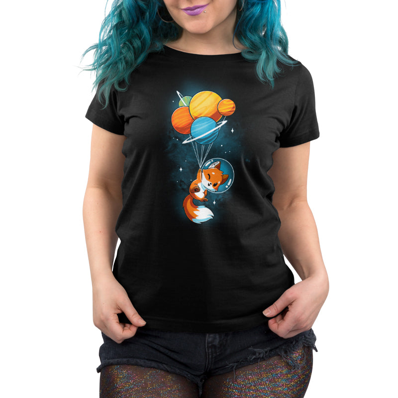 A woman wearing a black t-shirt with an orange fox on it from TeeTurtle.