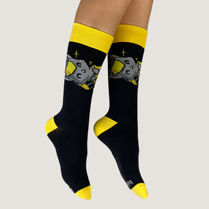 A pair of Friendly Kitty socks by TeeTurtle with an astronaut on them.