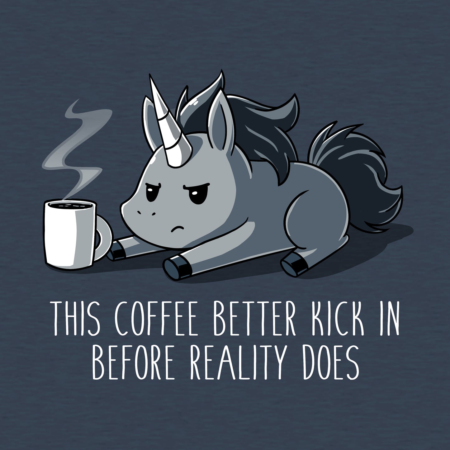 Teeturtle Denim Before Reality Kicks In Premium Cotton T-shirt. Featuring a grumpy-looking unicorn on its stomach with a cup of steaming coffee in front of it.