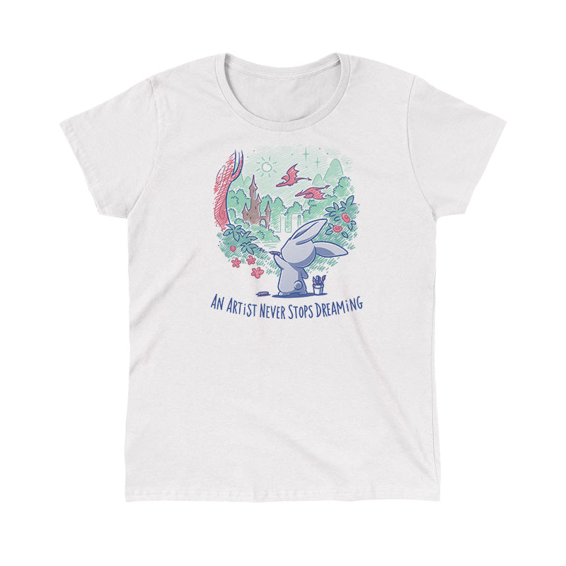 Classic Cotton T-shirt_TeeTurtle An Artist Never Stops Dreaming white t-shirt featuring a bunny painting a whimsical landscape with a castle, trees, and flying creature.