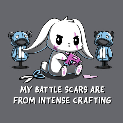 Classic Cotton T-shirt_TeeTurtle Battle Scars charcoal gray t-shirt featuring a determined cartoon rabbit holding a hot glue gun, surrounded by sewing supplies and mannequins, with the text "My battle scars are from intense crafting" below.