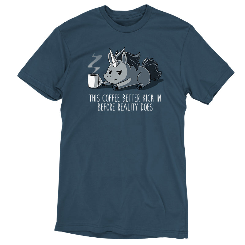 Teeturtle Denim Before Reality Kicks In Premium Cotton T-shirt. Featuring a grumpy-looking unicorn on its stomach with a cup of steaming coffee in front of it.