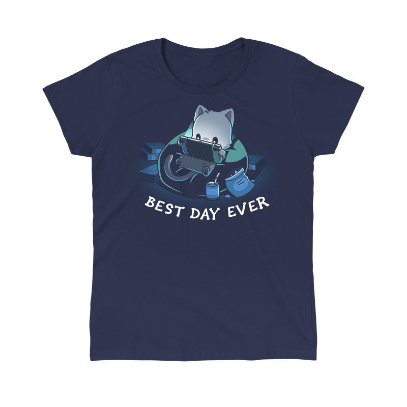 Classic Cotton T-shirt_TeeTurtle Best Day Ever navy blue t-shirt featuring an illustration of a cat sitting on a bean bag chair playing a portal video game surrounded by a mess of books and an open bag of chips and a can of soda with a straw. "BEST DAY EVER" is written underneath.