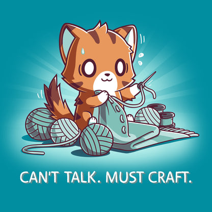 Classic Cotton T-shirt_TeeTurtle Can't Talk. Must Craft tropical blue t-shirt featuring a cat knitting with multiple yarn balls around and a concentrated expression. Text below reads "CAN'T TALK. MUST CRAFT."