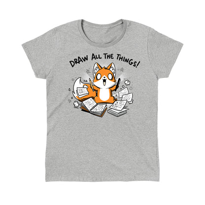 Classic Cotton T-shirt_A cartoon fox enthusiastically holding drawing tools, surrounded by sketchbooks with various drawings. Text above reads "Draw All The Things!" This monsterdigital original Draw all the Things! is crafted from super soft ringspun cotton for ultimate comfort.