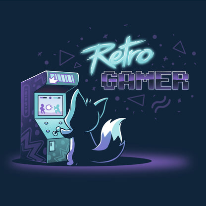 Classic Cotton T-shirt_TeeTurtle Retro Gamer navy blue t-shirt featuring a small, dark colored fox playing a vintage arcade game on a pixelated screen that shows two fighting figures with "Retro GAMER" written in the top right. The text is superimposed over various shapes, including stylized triangles, circular shapes, and wavy lines, in similar neon tones.