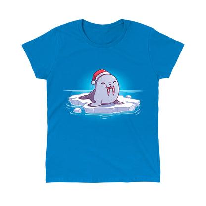 Classic Cotton T-shirt_TeeTurtle Sweet Tooth Sapphire Blue t-shirt featuring an illustration of a smiling walrus wearing a Santa hat, sitting on a floating ice. It's tusks are striped with red and white making them look like candy canes. It's also sticking out it's tongue. 