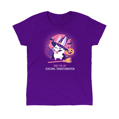 Classic Cotton T-shirt_TeeTurtle purple Time For My Seasonal Transformation apparel featuring a white bunny wearing a sparkling purple witch hat and cloak on top of a flying broom with a cauldron, bats, jack-o'-lantern, and the full red moon in the background.