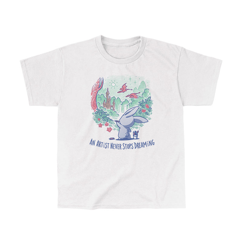 Classic Cotton T-shirt_TeeTurtle An Artist Never Stops Dreaming white t-shirt featuring a bunny painting a whimsical landscape with a castle, trees, and flying creature.