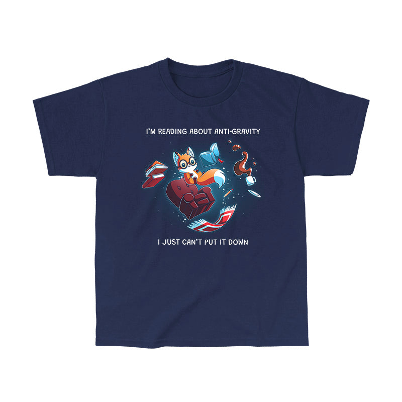 Classic Cotton T-shirt_TeeTurtle navy blue Anti-Gravity Enthusiast apparel featuring a fox wearing glasses reading a book with floating in mid-air with its living room furniture, such as a chair, rug, and lamp, with the caption, “I’m Reading About Anti-Gravity, I Just Can’t Put It Down“.