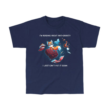 Classic Cotton T-shirt_TeeTurtle navy blue Anti-Gravity Enthusiast apparel featuring a fox wearing glasses reading a book with floating in mid-air with its living room furniture, such as a chair, rug, and lamp, with the caption, “I’m Reading About Anti-Gravity, I Just Can’t Put It Down“.