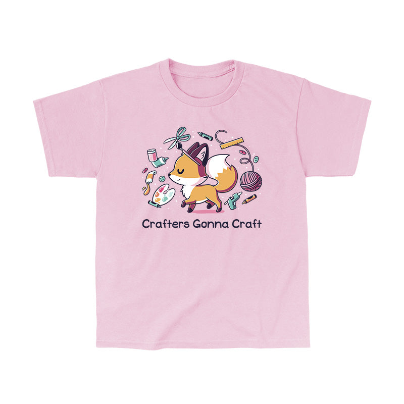 Classic Cotton T-shirt_TeeTurtle light pink Crafters Gonna Craft apparel featuring happy fox surrounded by crafting items such as paint, scissors, yarn, and glue. Caption below reads, "Crafters Gonna Craft".