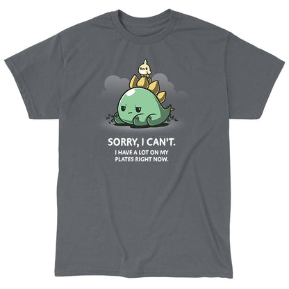 Classic Cotton T-shirt_TeeTurtle I Have A Lot On My Plates charcoal gray t-shirt featuring a grumpy stegosaurus dinosaur lying on the ground with a cute bird on its plates with a pun underneath.