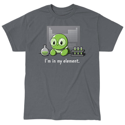 Classic Cotton T-shirt_A cartoon green turtle wearing glasses is in a lab with beakers and test tubes filled with green liquid. Text below reads, "I'm in my element." Wear this scene on an "I'm in My Element" apparel made from charcoal gray Super Soft Ringspun Cotton by monsterdigital.