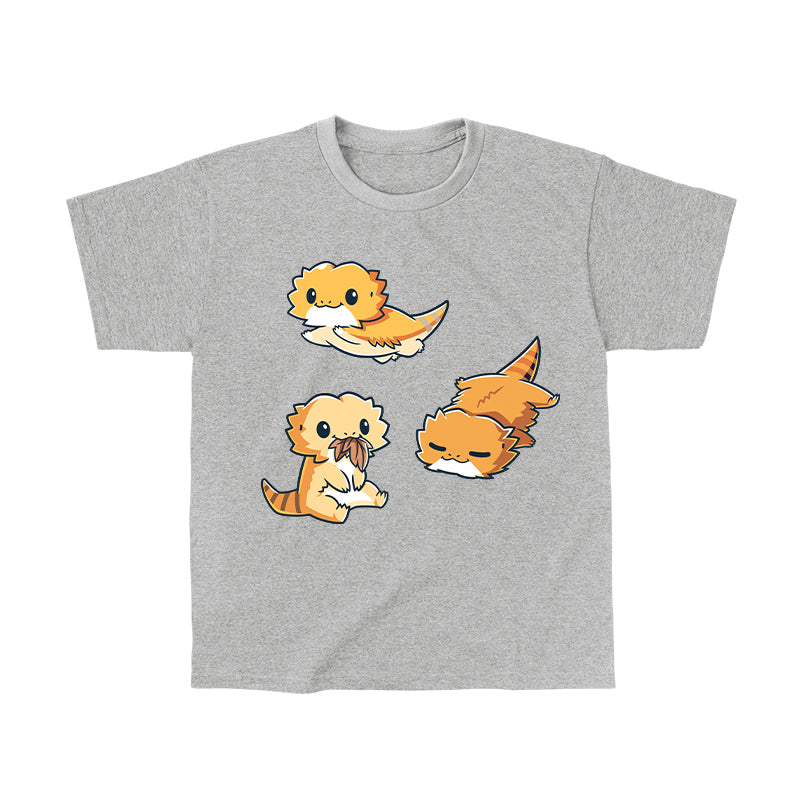 Classic Cotton T-shirt_TeeTurtle Lil Bearded Dragons Heather Gray t-shirt featuring three cartoon-style illustrations of Lil' Bearded Dragons in various poses: sitting and holding food, laying down, and standing on all fours with a happy expression.