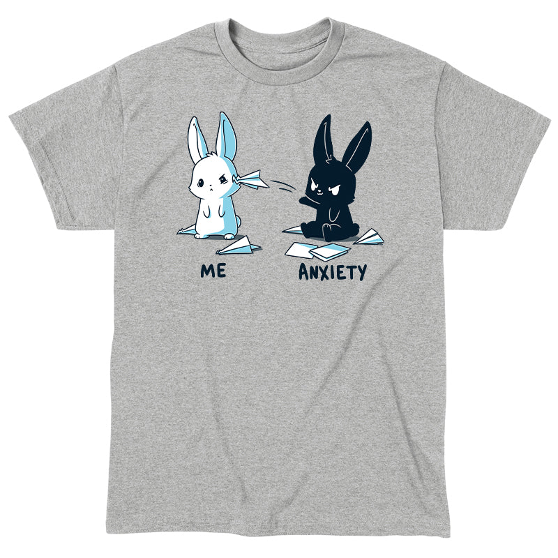 Classic Cotton T-shirt_TeeTurtle Me vs Anxiety heather gray t-shirt featuring an illustration of two cartoon bunnies. A white bunny is labeled "Me," and is looking annoyed while a paper airplane crashes into its face, while a black bunny labeled "Anxiety" aggressively throws paper planes at the other bunny. Paper planes are scattered on the ground around anxiety. 