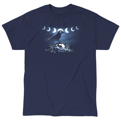 Classic Cotton T-shirt_TeeTurtle Mystical Crow navy blue t-shirt featuring a crow with glowing eyes standing on an animal skull in a grassy area under a night sky.