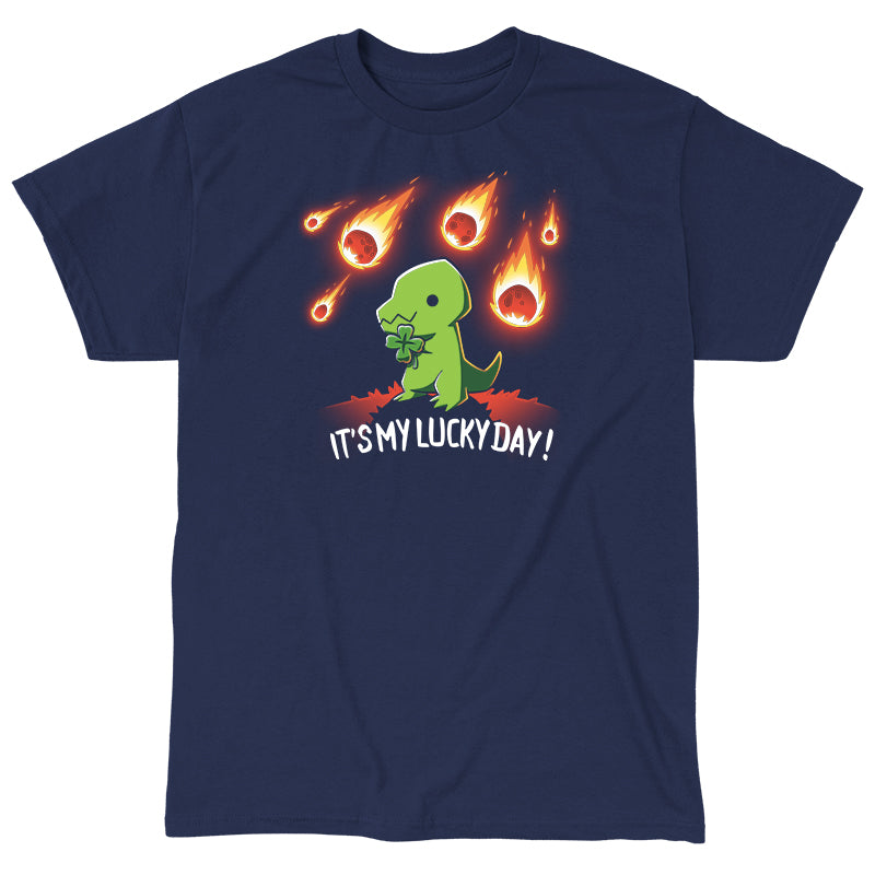 Classic Cotton T-shirt_TeeTurtle It's My Lucky Day navy blue t-shirt featuring a dinosaur holding a four-leaf clover while meteors fall from the sky. The text below reads, "It's my lucky day!"