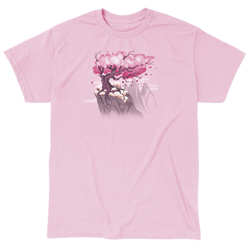 Classic Cotton T-shirt_TeeTurtle Sakura Tree light pink t-shirt featuring an illustration of a pink cherry blossom tree on a rocky cliff with mountains in the background. Blossoms and petals are being blown in the wind. 