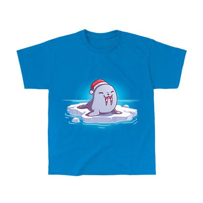 Classic Cotton T-shirt_TeeTurtle Sweet Tooth Sapphire Blue t-shirt featuring an illustration of a smiling walrus wearing a Santa hat, sitting on a floating ice. It's tusks are striped with red and white making them look like candy canes. It's also sticking out it's tongue. 