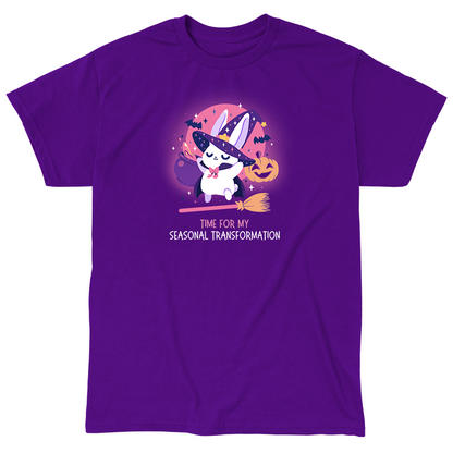 Classic Cotton T-shirt_TeeTurtle purple Time For My Seasonal Transformation apparel featuring a white bunny wearing a sparkling purple witch hat and cloak on top of a flying broom with a cauldron, bats, jack-o'-lantern, and the full red moon in the background.