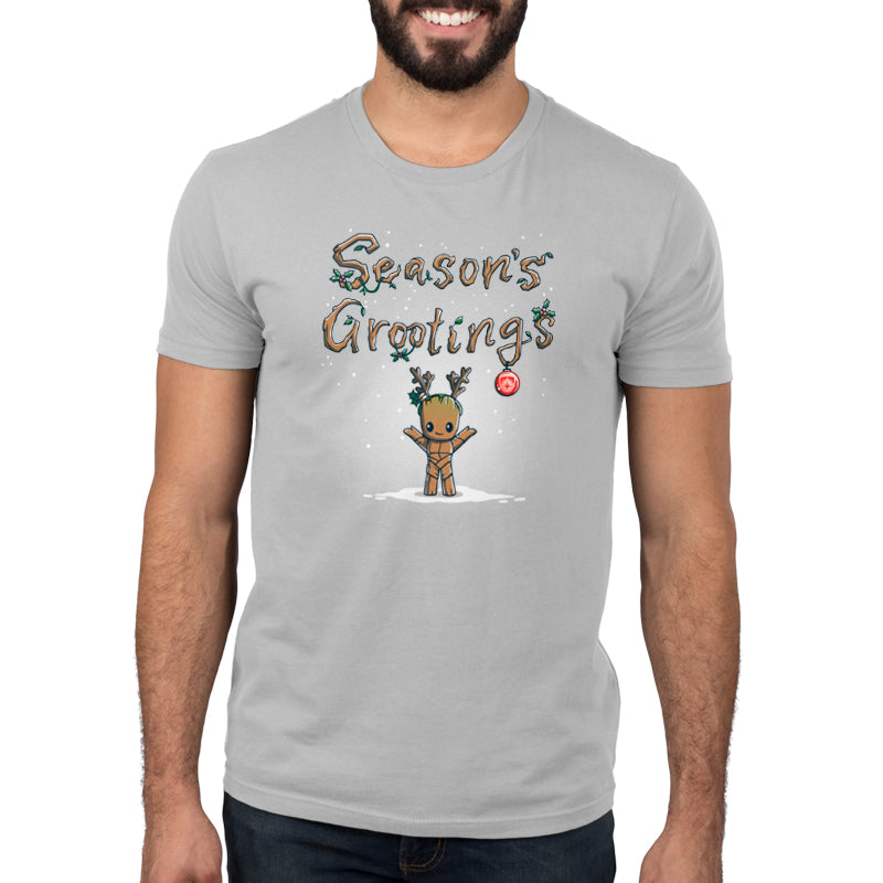 A man wearing a t-shirt with the Season's Grootings design by Marvel for the holidays.
