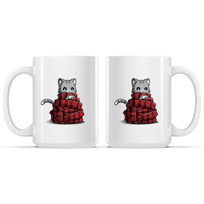 Ceramic Mug_TeeTurtle Get Cozy white mug featuring a smiling gray tabby cat wrapped in a cozy red plaid scarf while holding a warm mug.