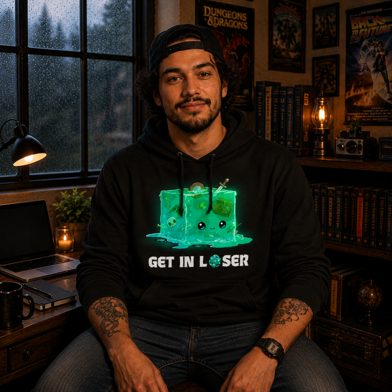 Pullover Hoodie_TeeTurtle black Get In Loser Pullover Hoodie featuring a smiling green gelatinous cube filled with bones and adventuring loot with the text "Get In Loser," featuring a twenty-sided die in place of the "O."