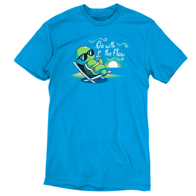 Premium Cotton T-shirt_Teeturtle cobalt blue Go with the Flow apparel featuring a turtle lounging on a beach chair with a tropical drink and sunglasses as the sun sets in the distance with the words 'Go with the Flow' to one side.