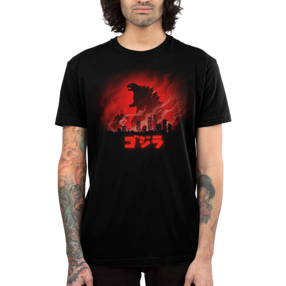 Premium Cotton T-shirt_TeeTurtle black Gojira apparel featuring a silhouette of Godzilla looming above a burning city, with "Gojira" in katakana underneath.