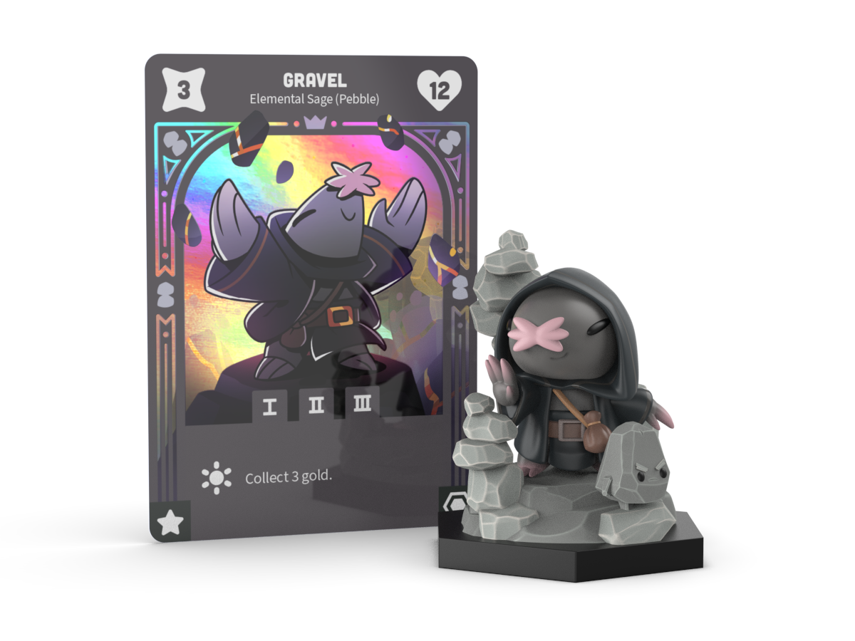 The Command of Nature: Gravel the Pebble Sage Vinyl Figure by Unstable Games stands beside a corresponding trading card labeled "Gravel, Command of Nature Sage," showcasing stats and abilities. This collectible desk toy is perfect for any enthusiast's workspace.