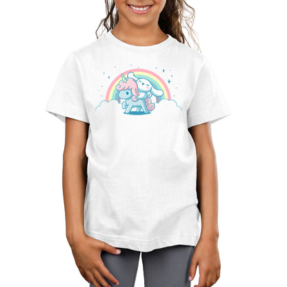 A girl wearing a white t-shirt with an officially licensed Cinnamoroll and Corune the Unicorn design from Sanrio on it.