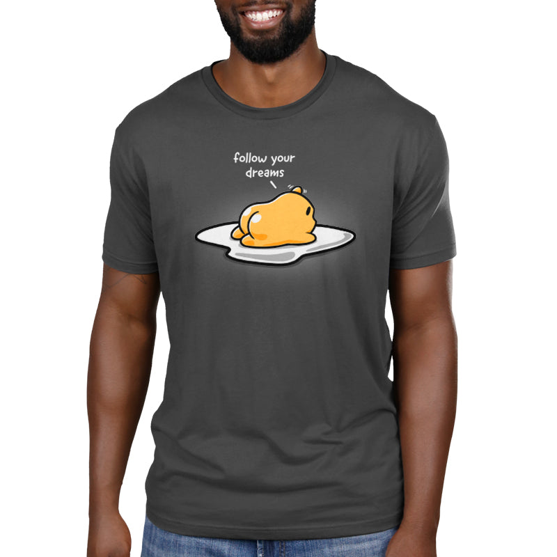 A man on a carefree journey wearing a Gudetama Follow Your Dreams t-shirt.