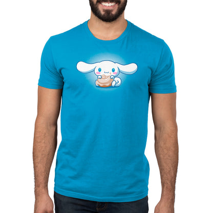 A man wearing a blue t-shirt with an officially licensed Just A Couple of Cinnamorolls by Sanrio on it.