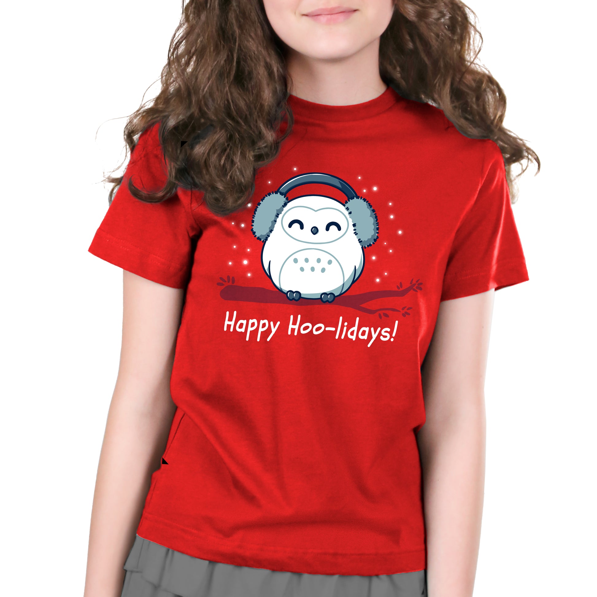 A girl wearing a red t-shirt that says "Happy Hoo-lidays" by TeeTurtle, radiating comfort.