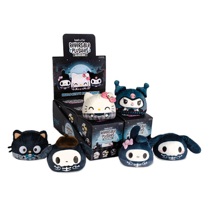 A display of TeeTurtle Reversible Plushie blind boxes featuring Sanrio characters in spooky skeleton or Halloween plaid outfits, shown with the blind box packaging