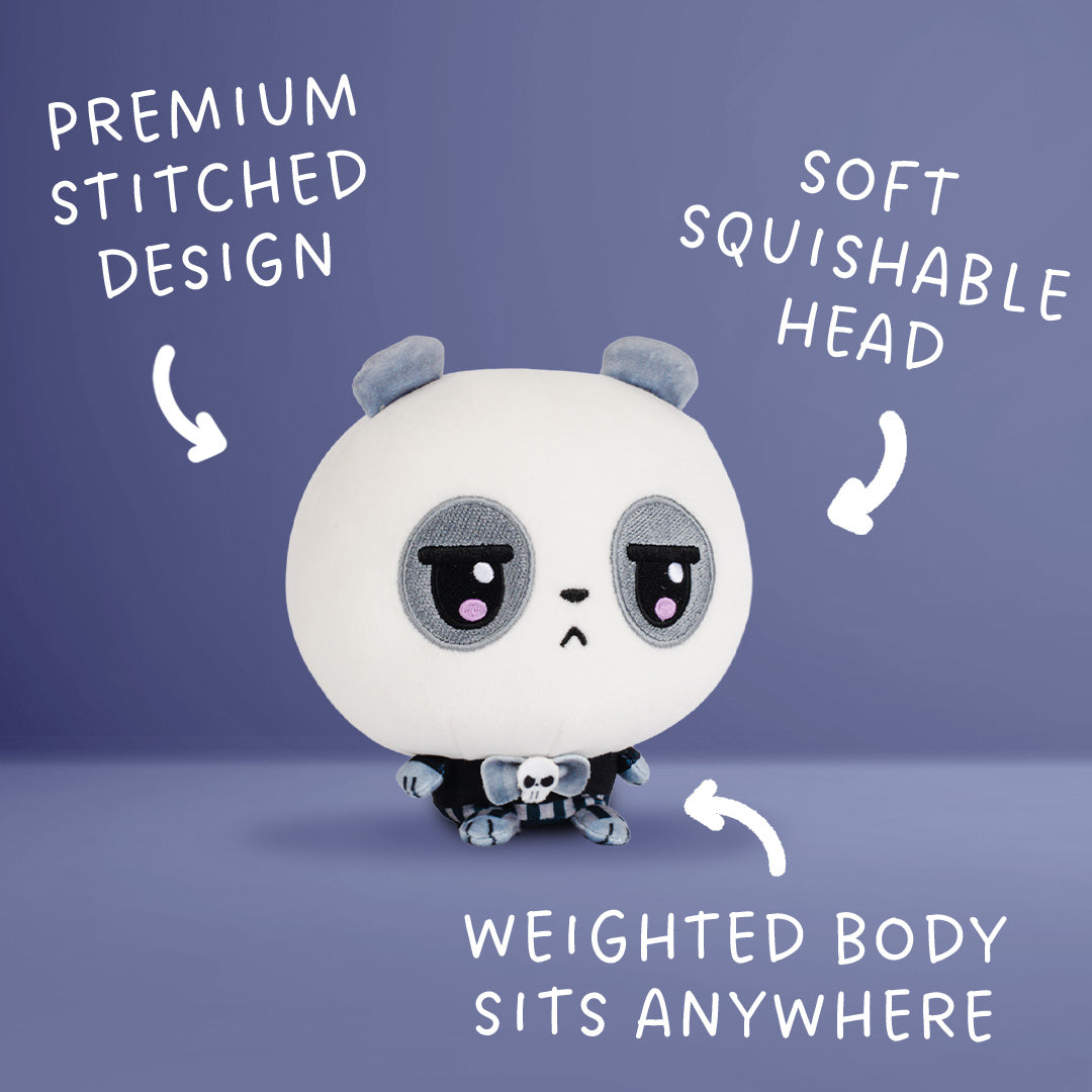 A round white panda plush toy with gray ears, large sad eyes, and a small black-and-white skull accessory, shown on a lavender background with white text callouts reading 'PREMIUM STITCHED DESIGN,' 'SOFT SQUISHABLE HEAD,' and 'WEIGHTED BODY SITS ANYWHERE.'.