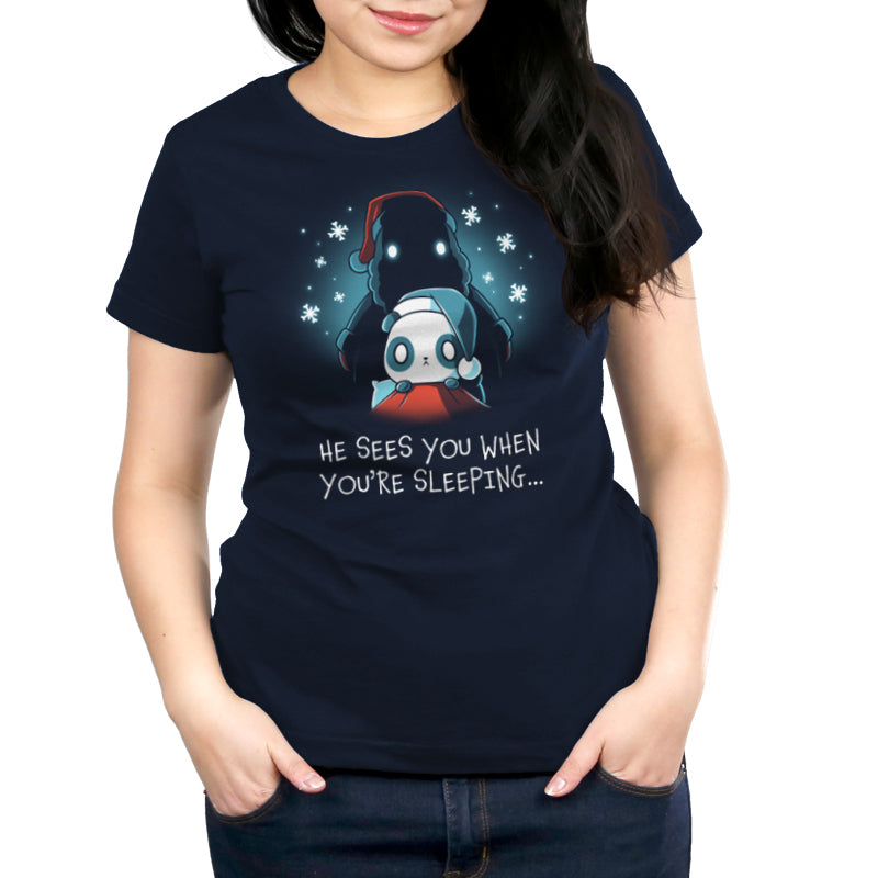 A navy blue women's t-shirt from TeeTurtle that says "He Sees You When You're Sleeping.