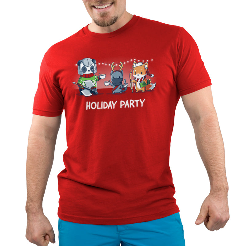 A man wearing a red t-shirt that says TeeTurtle Holiday Party, enjoying hot chocolate.