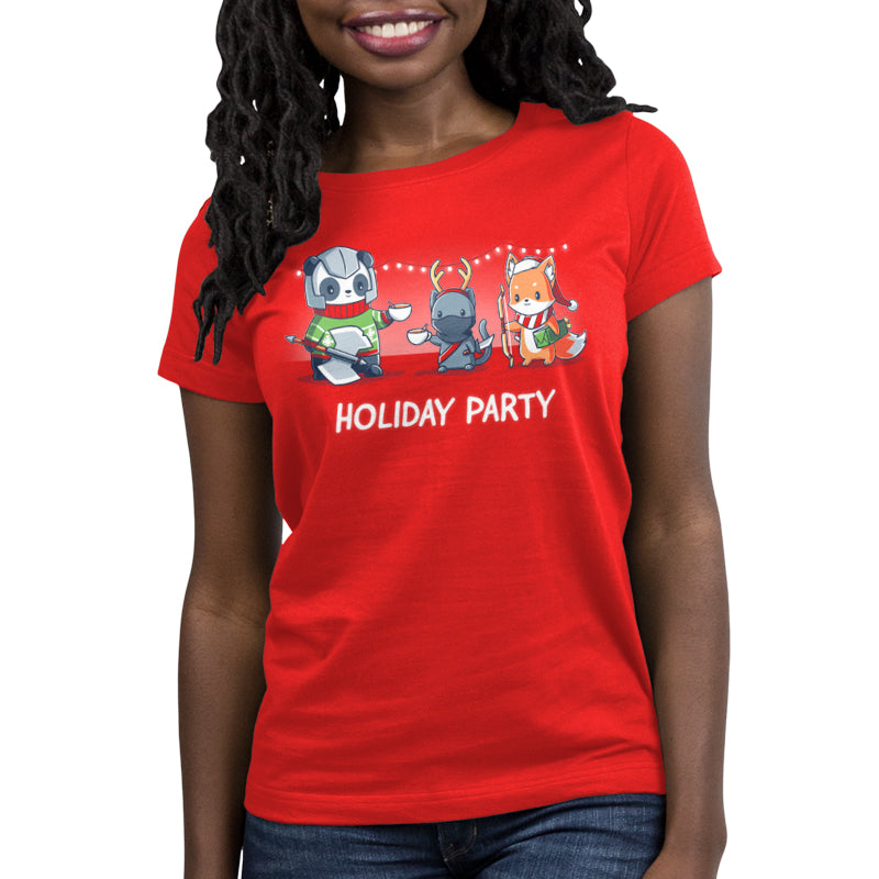 A woman wearing a red t-shirt from TeeTurtle that says Holiday Party looks festive and ready to celebrate.